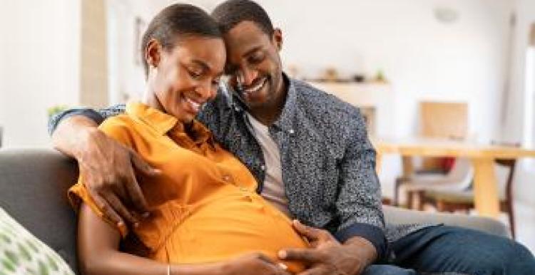 black_man_and_black_pregnant_woman_embracing