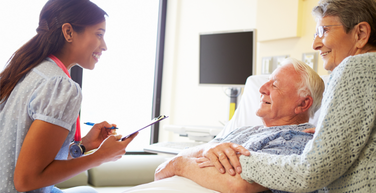 Man_and_woman_talking_to_a_doctor_in_hospital