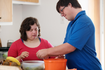 Man_and_woman_with_learning_difficulties_preparing_food